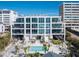 Modern condo building on the beach with a swimming pool and stunning ocean views from multiple floors at 6100 Midnight Pass Rd # 401, Sarasota, FL 34242