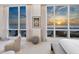 Coastal main bedroom with ocean views and neutral modern furnishings at 6100 Midnight Pass Rd # 401, Sarasota, FL 34242