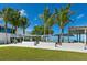 Park with grassy area, walkways, palm trees and pavilions at 6100 Midnight Pass Rd # 401, Sarasota, FL 34242