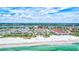 Aerial view of beachfront condo building with pool and ocean views at 6140 Midnight Pass Rd # 902, Sarasota, FL 34242