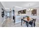 Kitchen and dining area with modern design and island at 6140 Midnight Pass Rd # 902, Sarasota, FL 34242