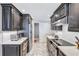 Modern kitchen with stainless steel appliances and dark wood cabinets at 6140 Midnight Pass Rd # 902, Sarasota, FL 34242