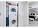 Stackable washer and dryer in a conveniently located laundry room at 6140 Midnight Pass Rd # 902, Sarasota, FL 34242