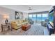 Living room boasts ocean views and comfortable seating at 6140 Midnight Pass Rd # 902, Sarasota, FL 34242