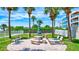 Relaxing patio area with grill and seating at 6140 Midnight Pass Rd # 902, Sarasota, FL 34242