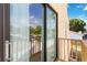 Private balcony with sliding glass door and view of trees at 6515 Mauna Loa Blvd, Sarasota, FL 34241