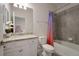 Clean bathroom, featuring a granite countertop, white cabinets, and a tub shower combo at 6527 Clairborne Ln, Bradenton, FL 34211