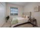 Cozy bedroom with window and neutral decor at 6527 Clairborne Ln, Bradenton, FL 34211