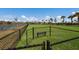 Enclosed dog park with bench near pond at 6527 Clairborne Ln, Bradenton, FL 34211