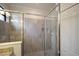 Walk-in shower with tiled walls and glass enclosure at 6527 Clairborne Ln, Bradenton, FL 34211