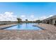 Community swimming pool with plenty of lounge chairs at 6527 Clairborne Ln, Bradenton, FL 34211