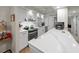 Modern kitchen featuring white cabinets and quartz counters at 6946 Woodwind Dr # 2, Sarasota, FL 34231