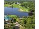 Aerial view of a golf course with water features and lush landscaping at 6947 Lennox Pl, University Park, FL 34201