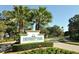 University Park Country Club entrance with lush landscaping at 6947 Lennox Pl, University Park, FL 34201