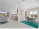 Elegant dining area with a teal rug and modern chairs at 6947 Lennox Pl, University Park, FL 34201