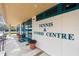 Tennis and fitness center entrance with potted plants at 6947 Lennox Pl, University Park, FL 34201