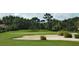 Landscaped green golf course with sand traps at 6947 Lennox Pl, University Park, FL 34201