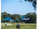 Golfer on the green with club house in the background at 6947 Lennox Pl, University Park, FL 34201