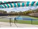 Outdoor pickleball courts with striped canopies at 6947 Lennox Pl, University Park, FL 34201