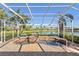 Enjoy the lake view from this luxurious screened spa at 6947 Lennox Pl, University Park, FL 34201