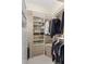 Spacious walk-in closet with ample shelving and hanging space at 6947 Lennox Pl, University Park, FL 34201