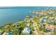 Aerial view of a house near the water, in a neighborhood setting at 7820 Holiday Dr, Sarasota, FL 34231