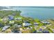 Stunning aerial view of waterfront property, showcasing the home and neighborhood at 7820 Holiday Dr, Sarasota, FL 34231