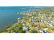 Aerial view of a home nestled in a waterfront community, near the water at 7820 Holiday Dr, Sarasota, FL 34231