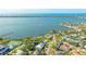 Wide aerial showcasing a home's waterfront location and neighborhood context at 7820 Holiday Dr, Sarasota, FL 34231