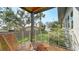 Relaxing balcony space overlooking backyard and waterfront at 7820 Holiday Dr, Sarasota, FL 34231