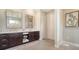 Elegant bathroom with double vanity, large mirrors, and ample storage at 7820 Holiday Dr, Sarasota, FL 34231