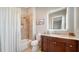 Clean bathroom with a shower/tub combo, updated vanity, and modern fixtures at 7820 Holiday Dr, Sarasota, FL 34231