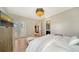 Bright bedroom with king-size bed, TV, and access to private balcony at 7820 Holiday Dr, Sarasota, FL 34231