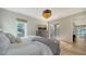 Bright bedroom with access to private balcony and outdoor space at 7820 Holiday Dr, Sarasota, FL 34231