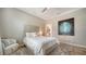 Guest bedroom with a queen bed, plenty of light, and a serene atmosphere at 7820 Holiday Dr, Sarasota, FL 34231