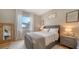 Cozy bedroom with queen-size bed and large window at 7820 Holiday Dr, Sarasota, FL 34231