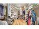 Large walk-in closet with ample shelving and hanging space at 7820 Holiday Dr, Sarasota, FL 34231