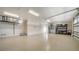 Large garage with ample storage space and epoxy flooring at 7820 Holiday Dr, Sarasota, FL 34231