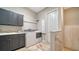 Convenient laundry room with front-load washer and dryer, cabinets, and a sink at 7820 Holiday Dr, Sarasota, FL 34231