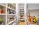 Well-organized pantry with ample shelving for food storage at 7820 Holiday Dr, Sarasota, FL 34231