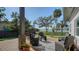 Relaxing patio with seating area and view of the water at 7820 Holiday Dr, Sarasota, FL 34231