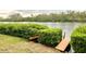 Wooden dock on calm river at 7820 Midnight Pass Rd, Sarasota, FL 34242