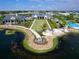 Aerial view of community with clubhouse and lake access at 7917 Mainsail Ln, Sarasota, FL 34240