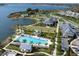 Expansive aerial view of community amenities and lake at 7917 Mainsail Ln, Sarasota, FL 34240