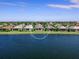 Houses along a calm lake on a sunny day at 7917 Mainsail Ln, Sarasota, FL 34240