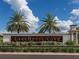 Lake House Cove community entrance with signage and landscaping at 7917 Mainsail Ln, Sarasota, FL 34240