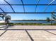 Large covered patio offering stunning lake views at 7917 Mainsail Ln, Sarasota, FL 34240