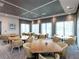 Bright dining room featuring multiple tables and yellow chairs at 7917 Mainsail Ln, Sarasota, FL 34240