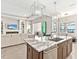 Modern kitchen with large island and granite countertops at 7917 Mainsail Ln, Sarasota, FL 34240