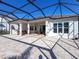 Covered patio and screened enclosure with view of house exterior at 7917 Mainsail Ln, Sarasota, FL 34240